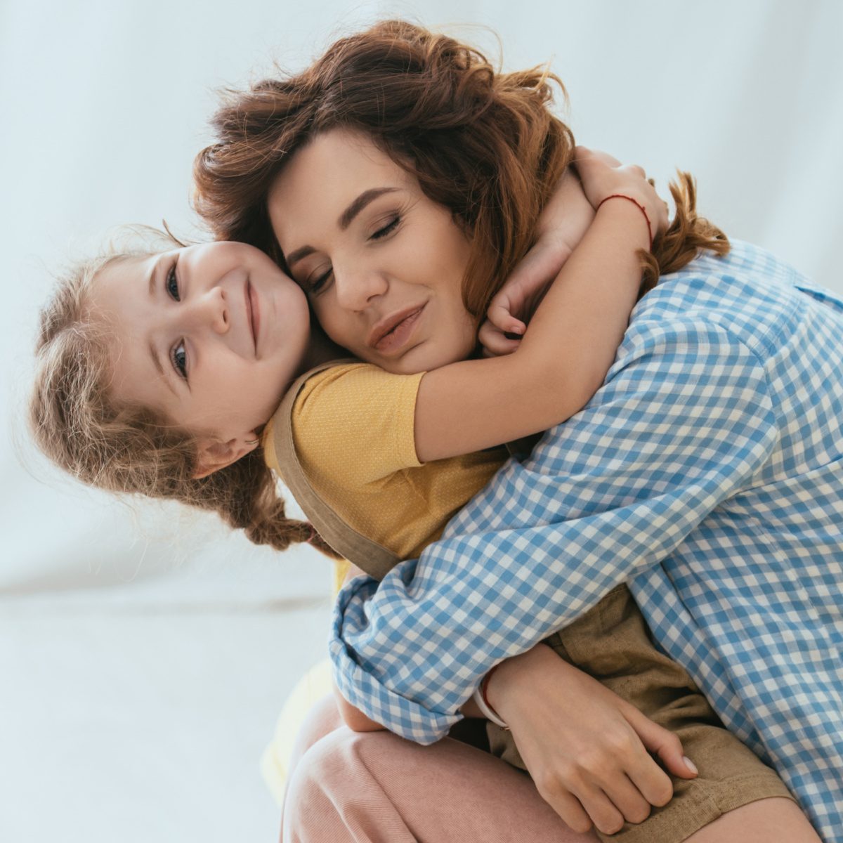 Family Law a mother and daughter hugging after meeting with a Fort Wayne protective order lawyer